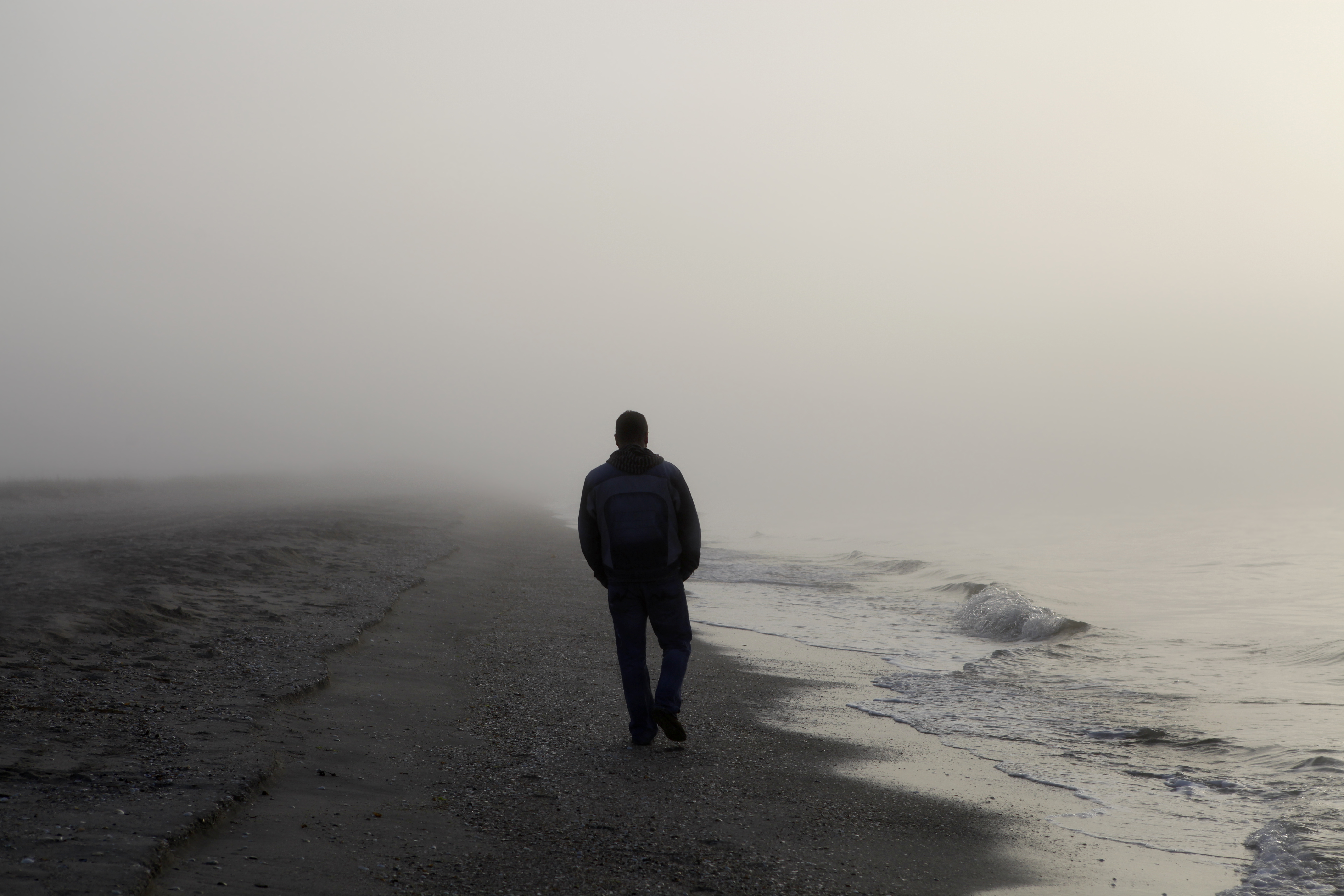 Man Walking Alone On A Foggy Beach John Englander Sea Level Rise Expert