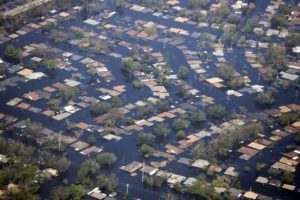 GWB: Flooding caused by Hurricane Katrina in the New Orleans area is visible from Air Force One Wednesday, Aug. 31, 2005, as President Bush was alble to survey the ravages of the storm during his return from Crawford, Texas to Washington D.C. White House photo by Paul Morse