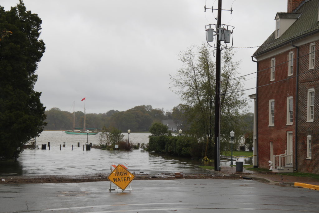Flooded street illustrates differences with storms tides and sea level rise